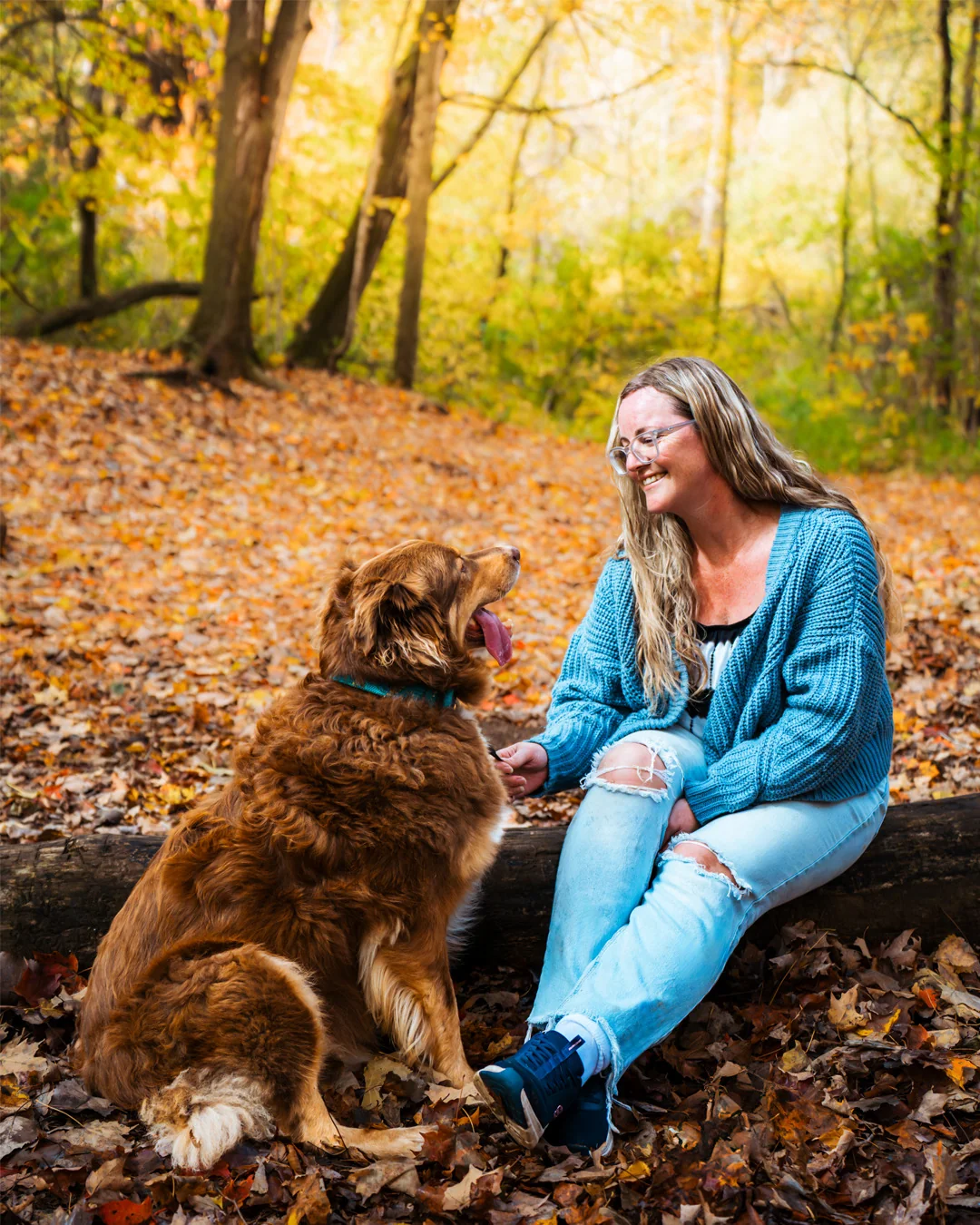 Woman with her dog during an autumn photography session